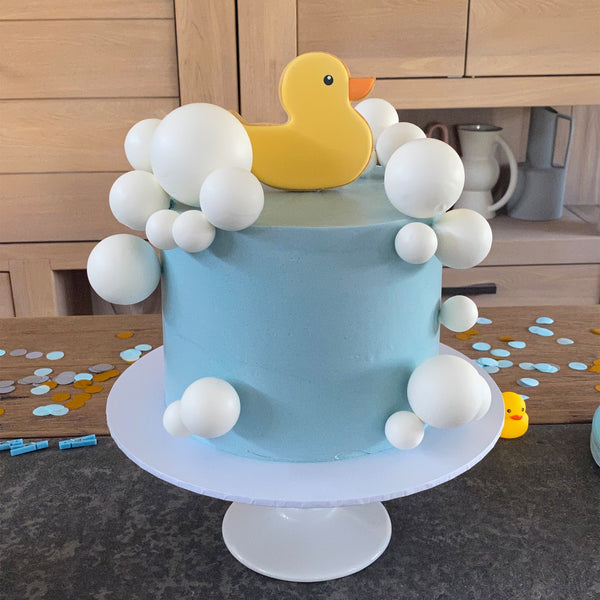 CUSTOM CAKE WITH CUSTOM COOKIE RUBBER DUCK TOPPER